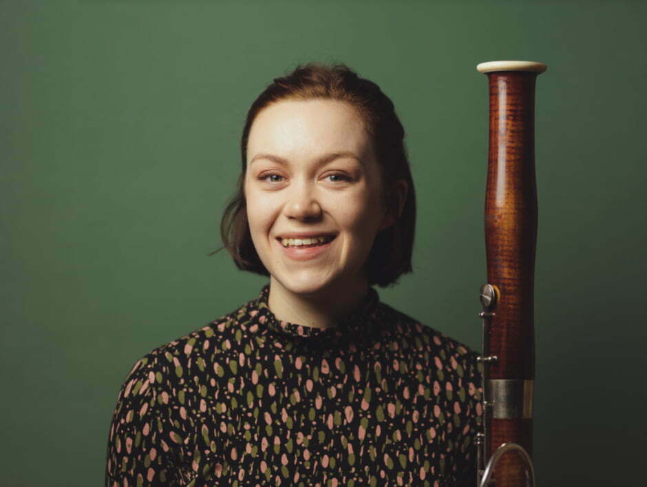 Holly Redshaw with bassoon headshot smiling